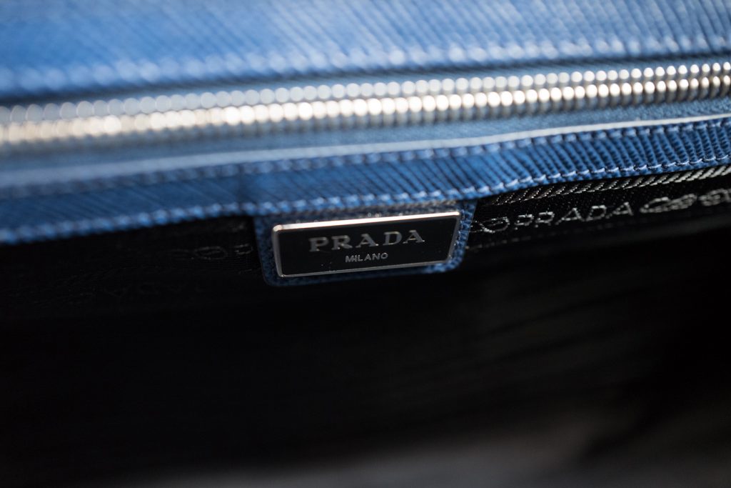 Prada metal logo